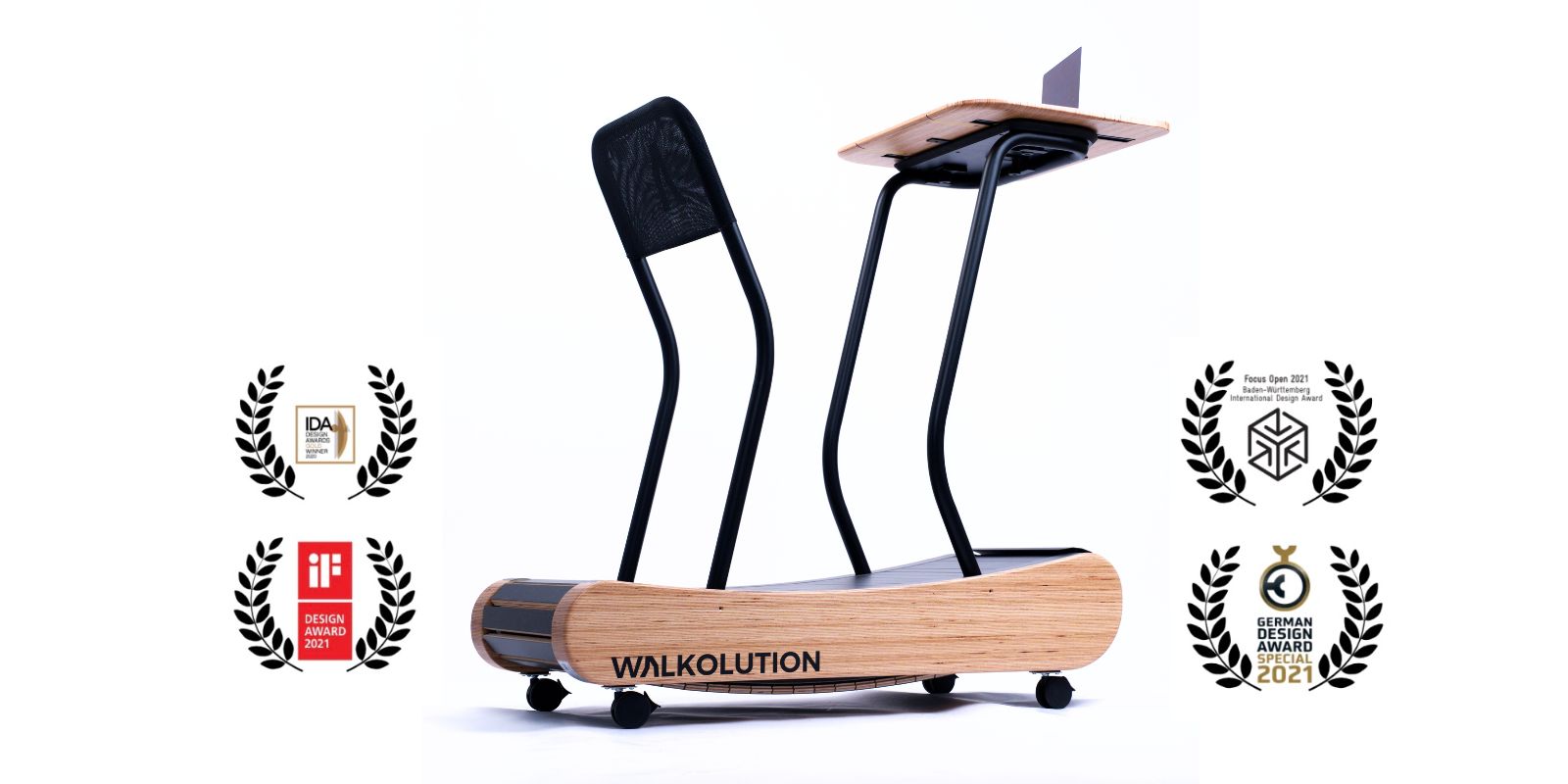 A modern wooden treadmill with a mesh backrest and a small desk for a laptop. Surrounded by four design award badges, the treadmill is branded WALKOLUTION.