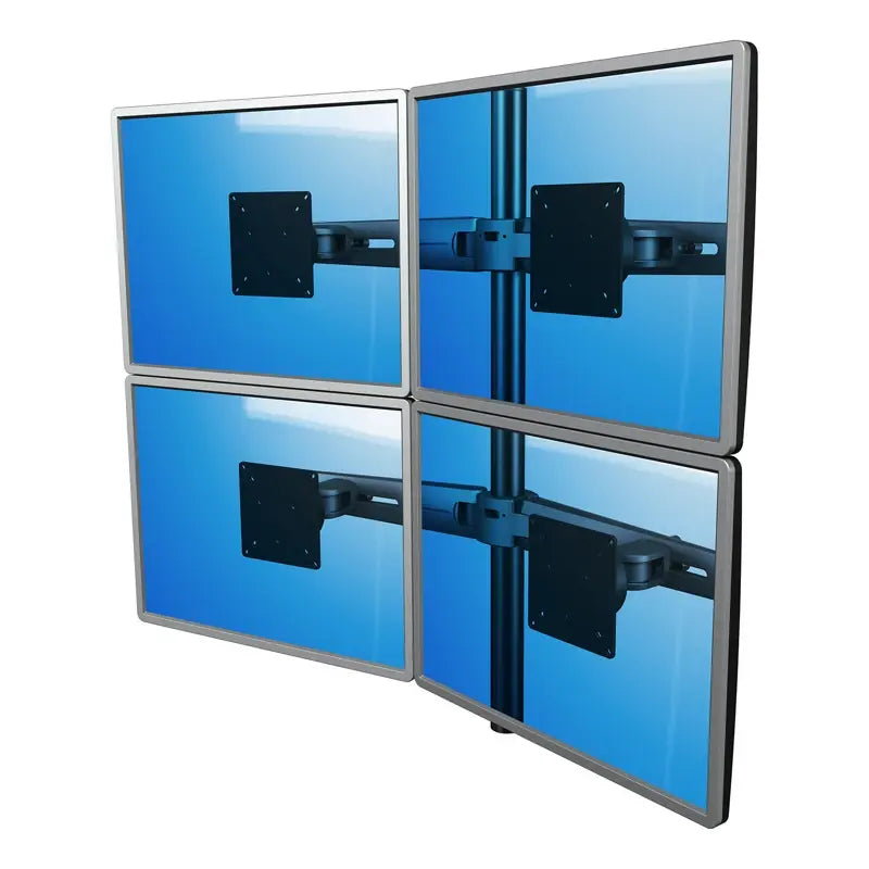 Four monitors are arranged in a 2x2 grid on the Monitor arm Viewmaster Multi (For four screens), each displaying a blue screen with visible mounting brackets and tidy cables for an organized multi-monitor setup.