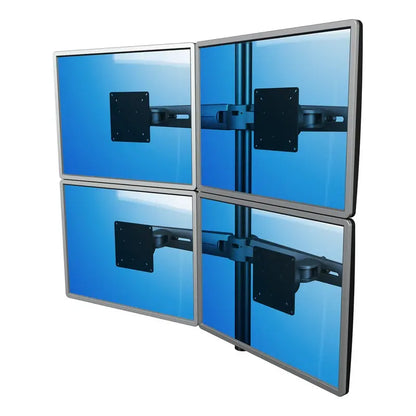 Four monitors are arranged in a 2x2 grid on the Monitor arm Viewmaster Multi (For four screens), each displaying a blue screen with visible mounting brackets and tidy cables for an organized multi-monitor setup.