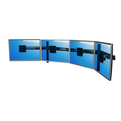 Four flat screens are mounted side by side on the Viewmaster Multi monitor arm (for four screens in a row), each displaying a blue screen, with visible black brackets at the back for an organized, ergonomic workspace.