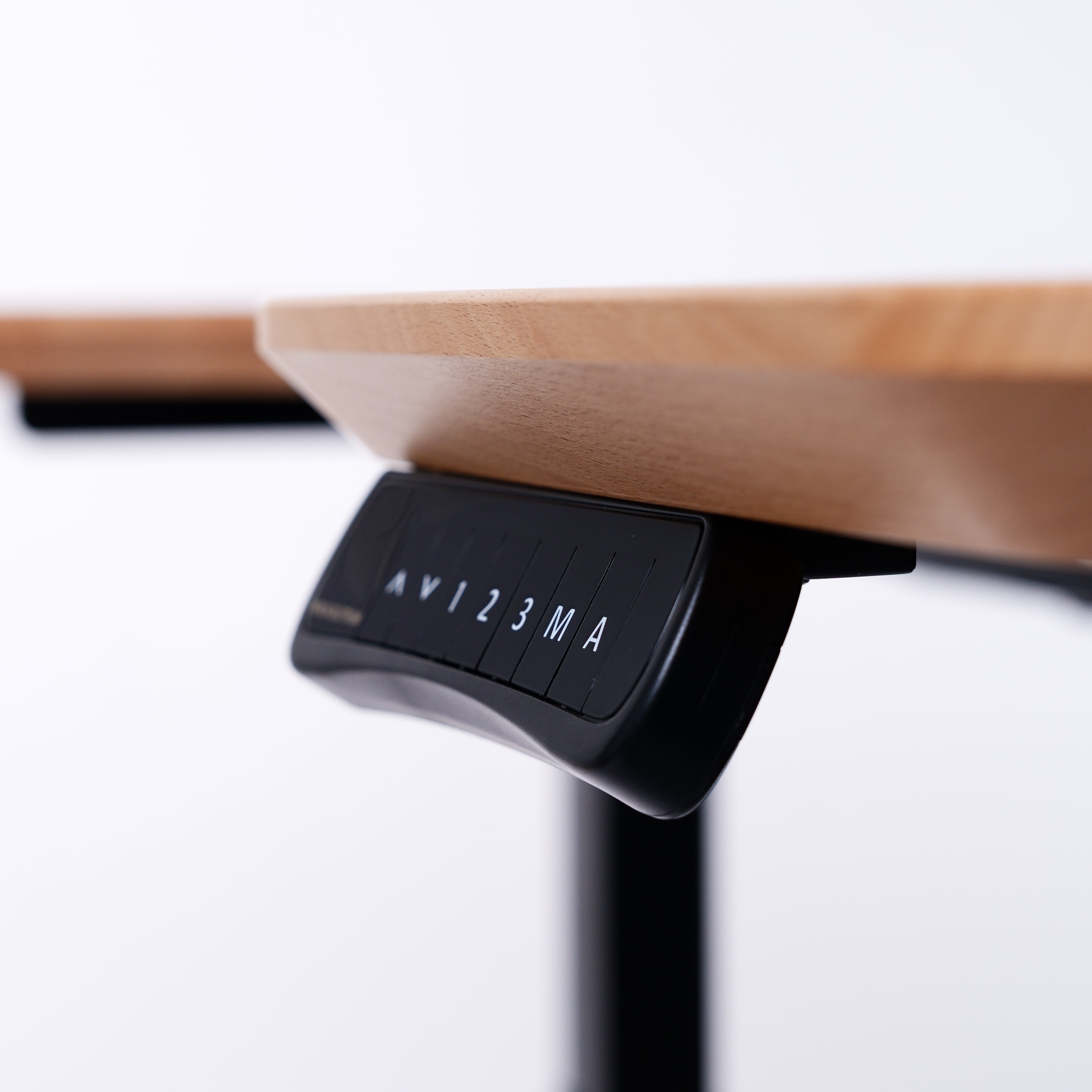 A close-up of a wooden desk with a digital control panel underneath, featuring labeled buttons including AV, 1, 2, 3, and M/A, set against a plain background. Walkolution Global