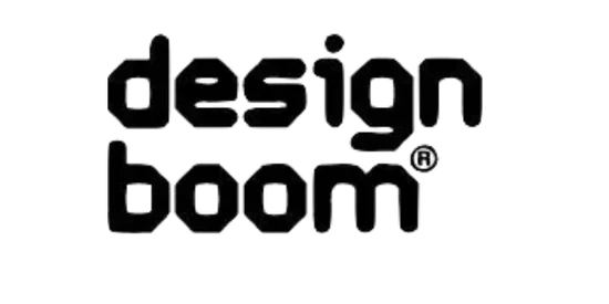 The image shows the design boom® logo in bold, black, rounded lowercase letters on a white background.