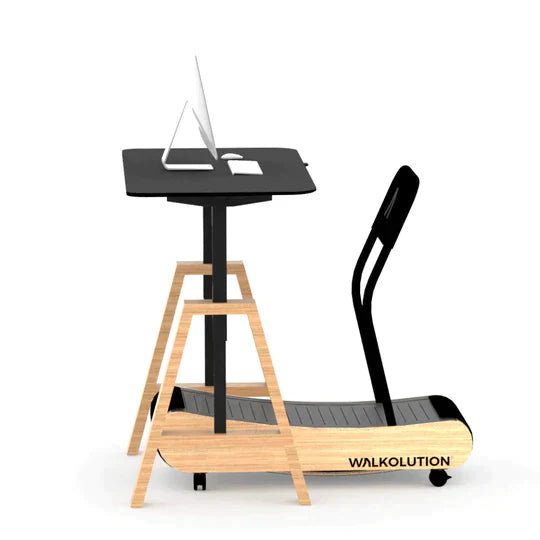 A modern treadmill desk setup with a wooden frame, black treadmill labeled WALKOLUTION, a black standing desk surface, computer monitor, keyboard, and mouse on top. A black backrest is attached to the treadmill.