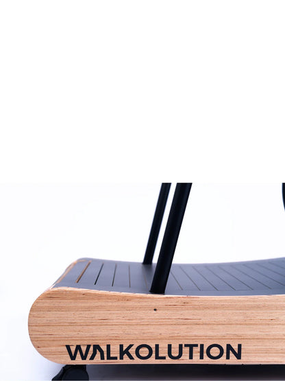 Close-up of a Walkolution 1 manual treadmill base with black slats and two vertical bars. Perfect as a walking desk or treadmill for work, the bold Walkolution branding is visible on the side against a white background.