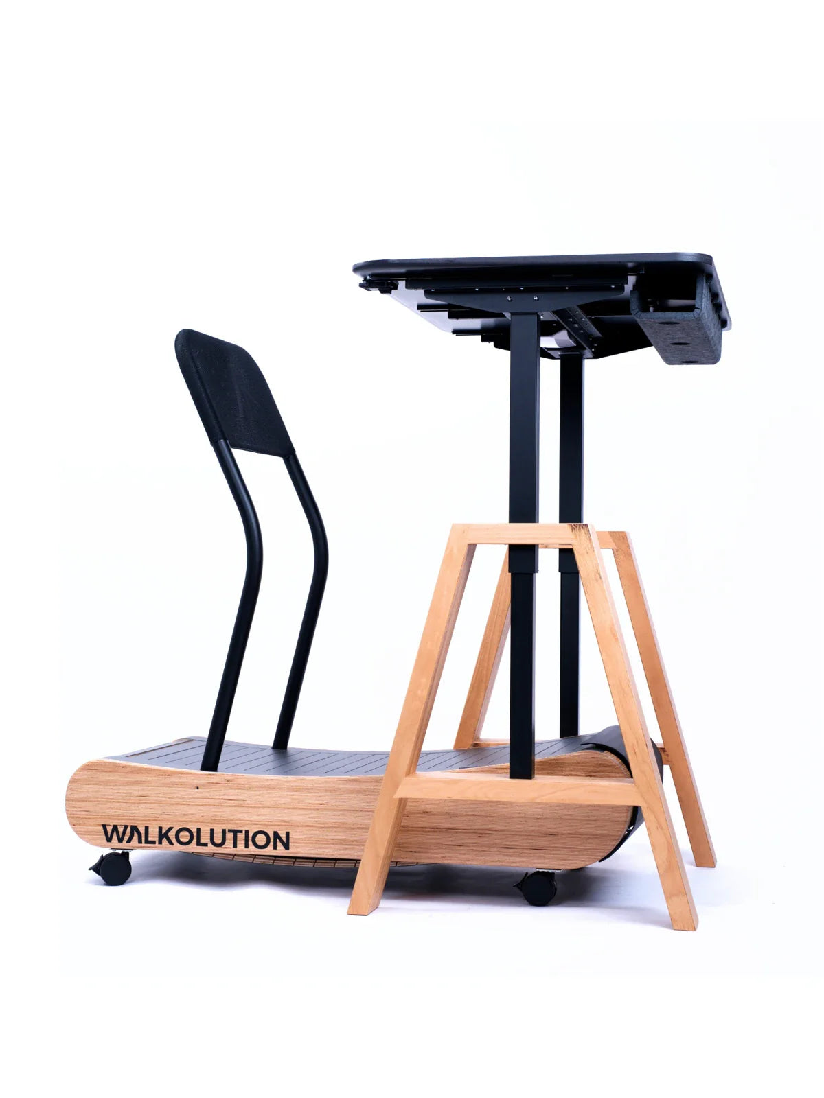 The Walkolution 1 is a wooden manual treadmill featuring a black mesh backrest and a height-adjustable standing desk, designed for walking while working—perfect for productive work setups. Walkolution Global