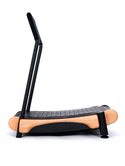 The Walkolution 2 is a curved, manual office treadmill with a wooden frame, black running surface, two upright handles, and a minimalist design—perfect for walking while you work, shown against a white background.