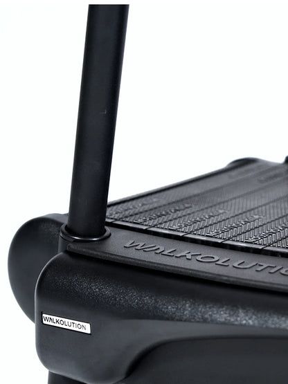 Close-up of the black Walkolution 2 motorless office treadmill, featuring the brand name on the side and textured walking surface—ideal for walking as you work.