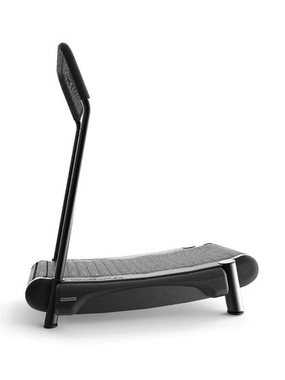 The Walkolution 2 is a modern, curved manual office treadmill with a textured running surface and a single angled handrail, shown side view on a white background—ideal for walking while you work.