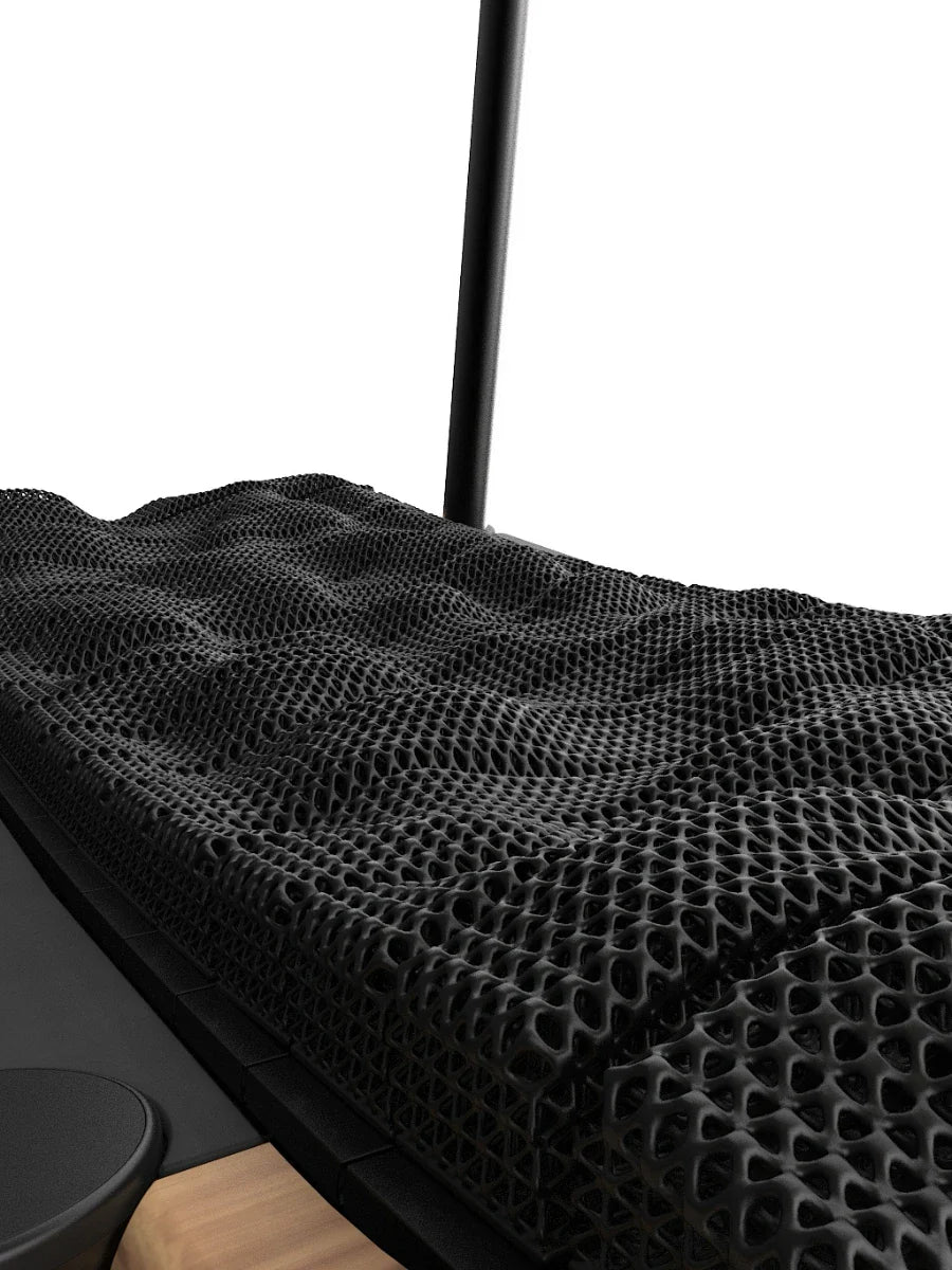 Close-up of a treadmill deck with a black, textured, 3D-printed running surface featuring a wavy, porous pattern; a black rail and part of a wooden accent are also visible. Walkolution Global