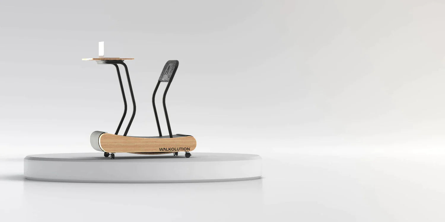 A modern treadmill desk with a wooden base, black supports, and a small tabletop for a laptop, displayed on a circular white platform against a light grey background.