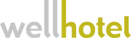Logo with the word wellhotel, where well is in gray lowercase letters and hotel is in yellow lowercase letters. The last three letters of well are extended vertically.